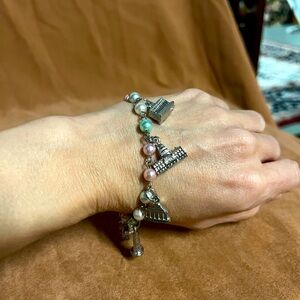 Beautiful silver tone charm bracelet. unique charms of historic buildings